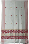 Pride of Assam white jute gamucha with red and gold floral border and motifs. Handwoven Assam textile for face, hair, or wear.