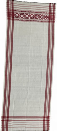 Pride of Assam white and red handloom gamusa made of pokua fabric with floral motif on one side.